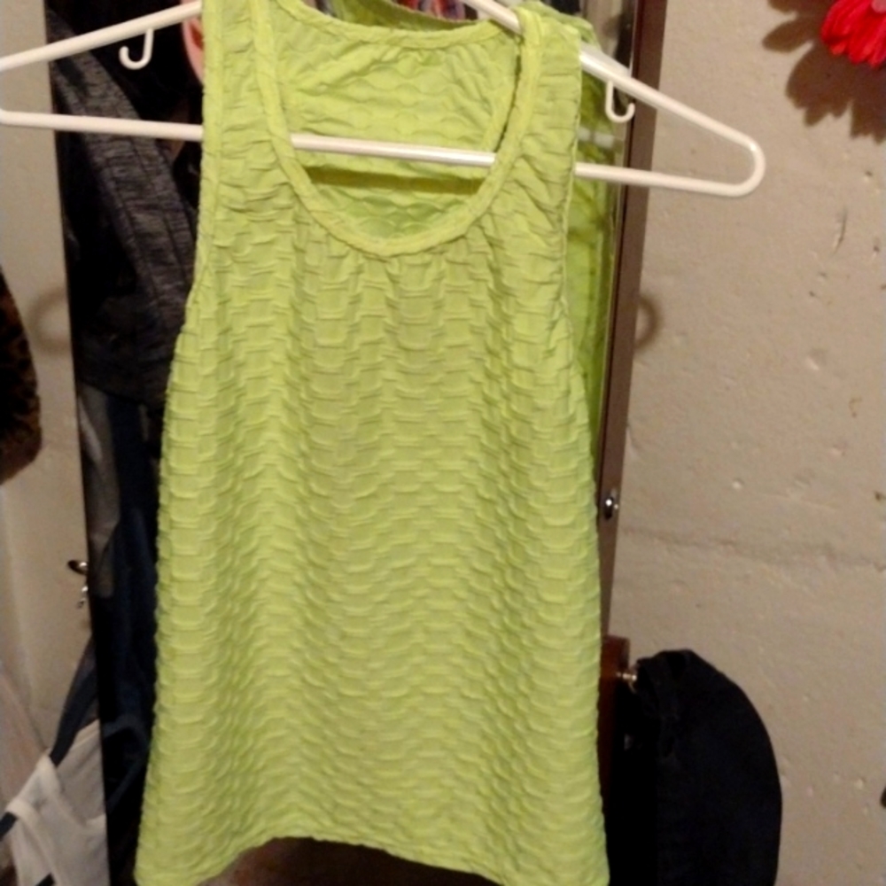Size Small cute tank shirt. Florescent green.Makes your summer tan look stunning